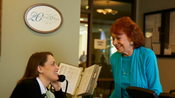 Staff and resident engaging at the reception area