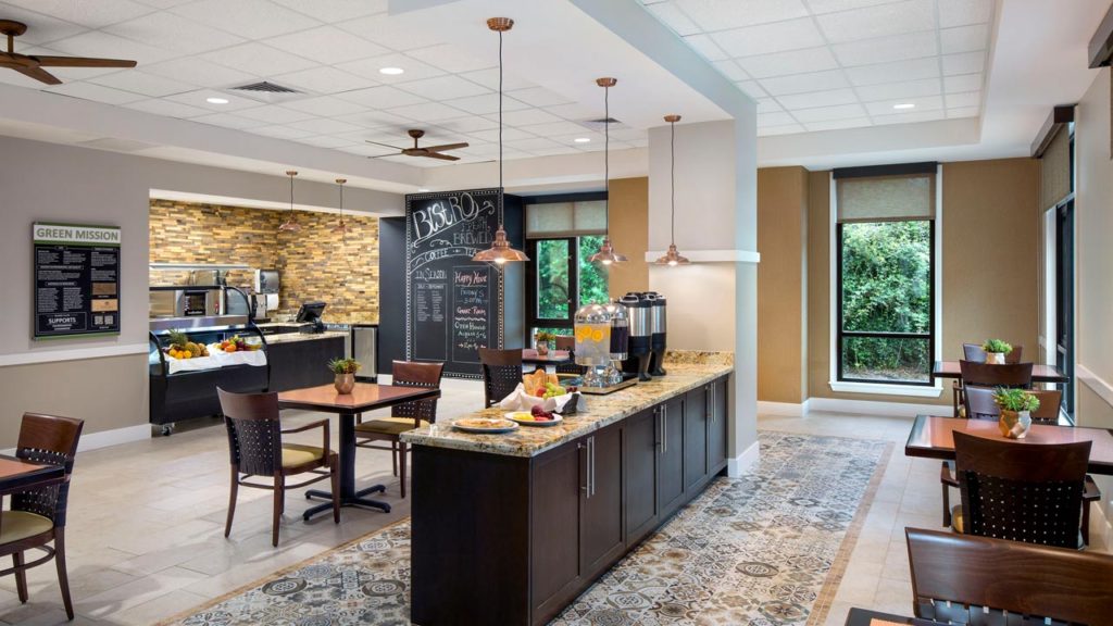 Bright dining area with tables and food service