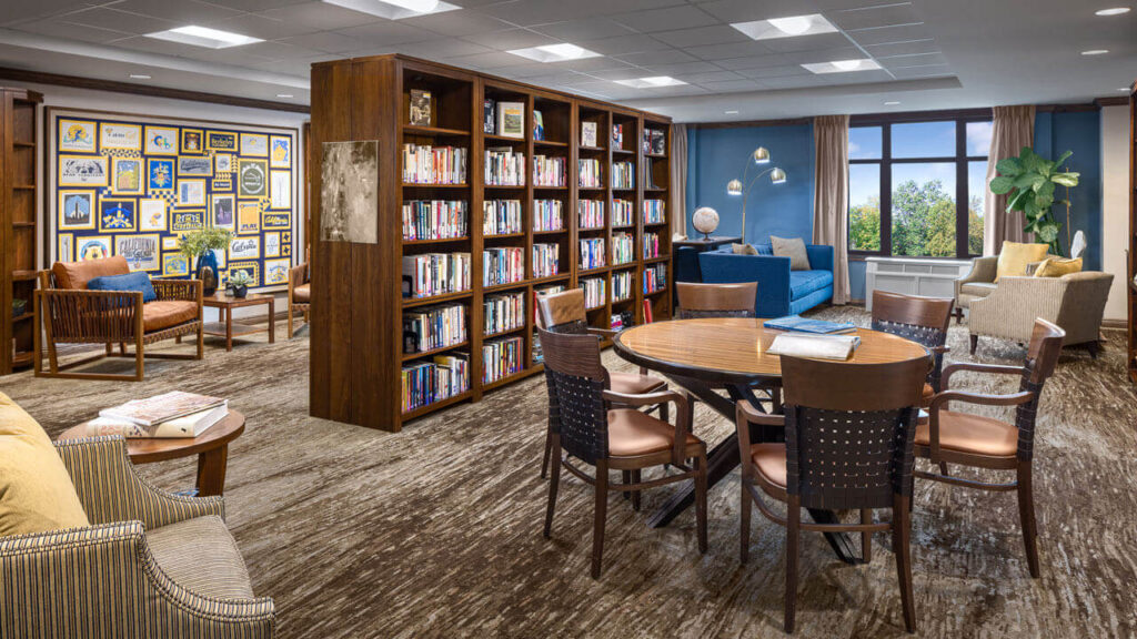 Interior view of a common area with bookshelves and seating