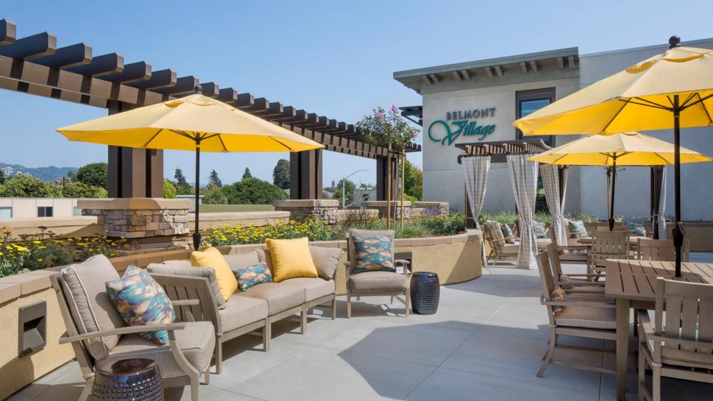 Outdoor patio area with seating and umbrellas
