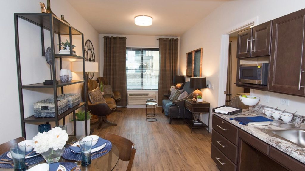 Well-furnished interior of a resident unit with kitchen