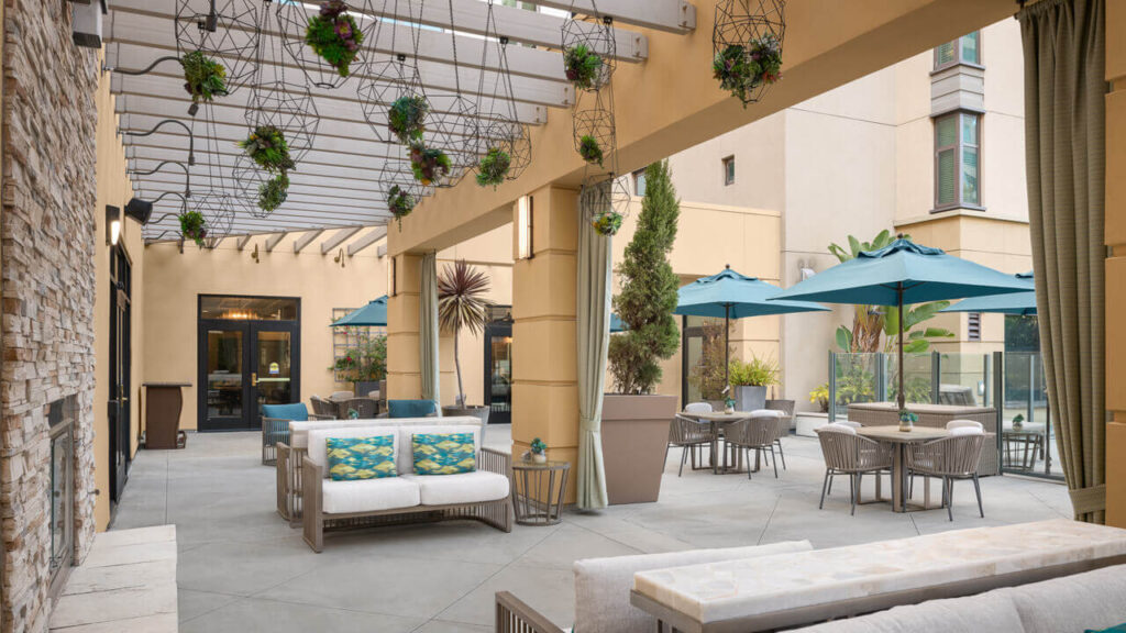 Outdoor patio area with seating and umbrellas