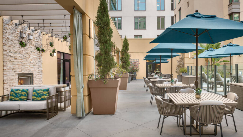 Outdoor patio area with seating and umbrellas