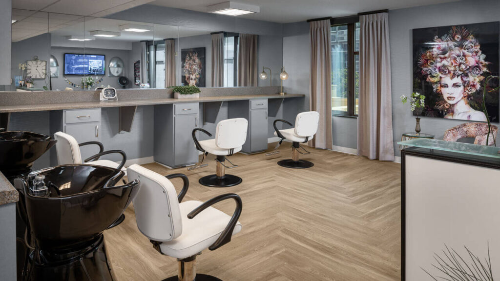 Hair salon area with styling chairs and sinks