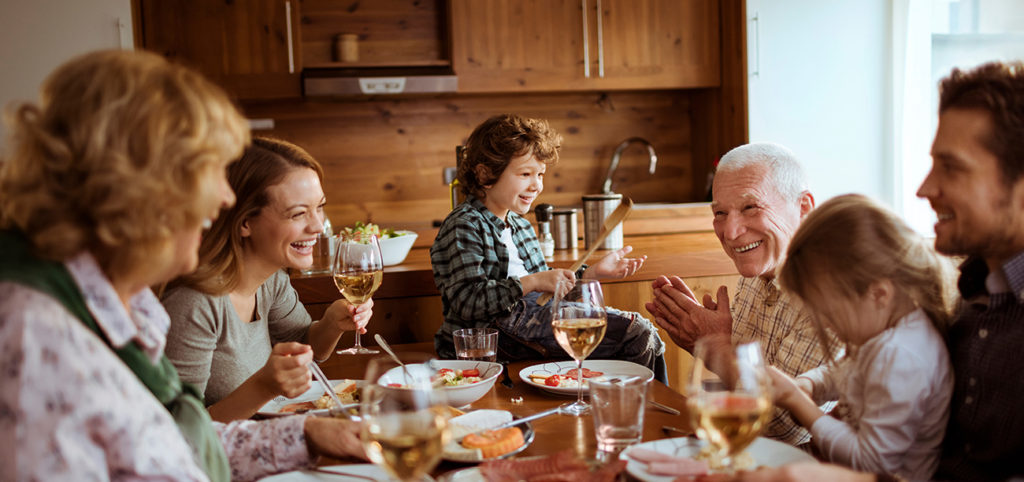 Residents and family enjoying a meal together