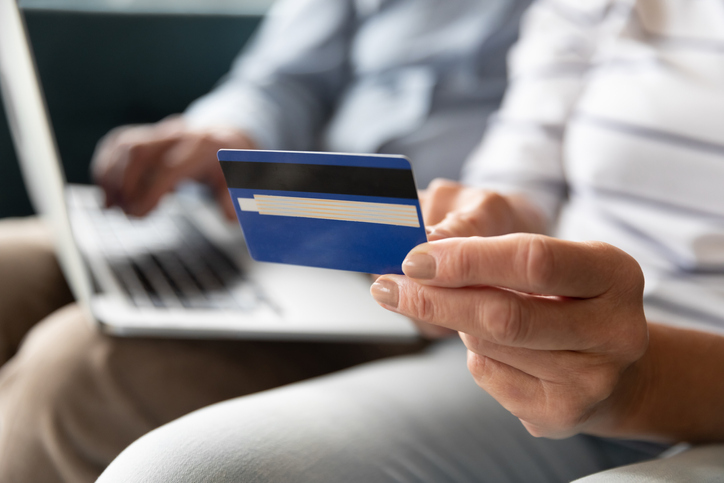 Close-up of a person holding a credit card