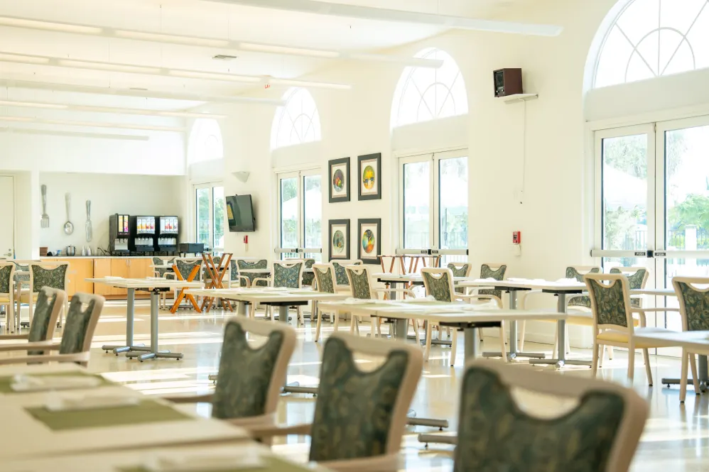 Bright dining room with tables and chairs