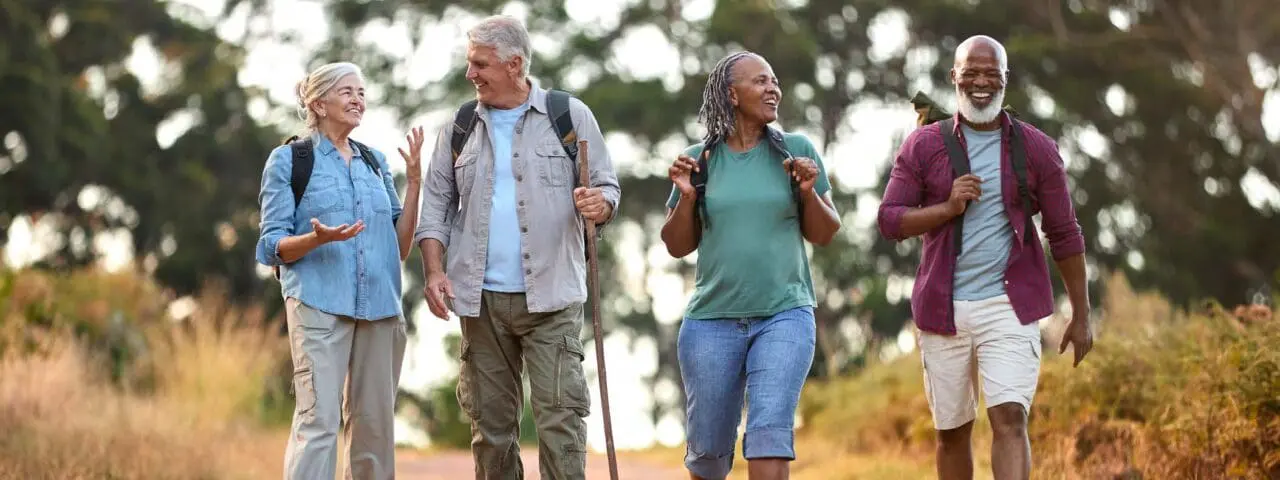 Group of seniors hiking on a nature trail