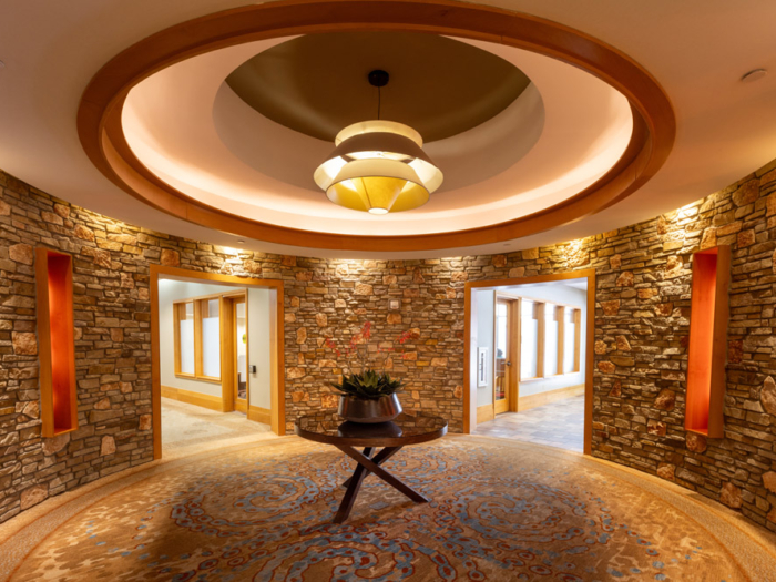 Brightly lit interior entrance with stone walls