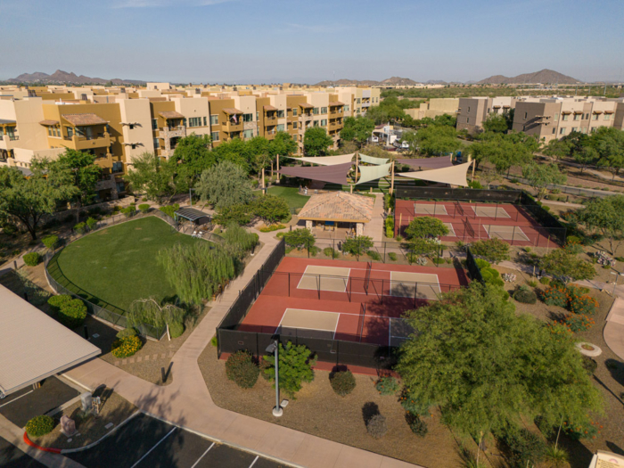 Aerial view of outdoor tennis courts and landscaped area