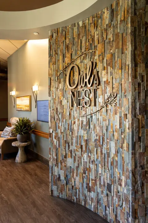Entrance to a common area with stone wall and decor