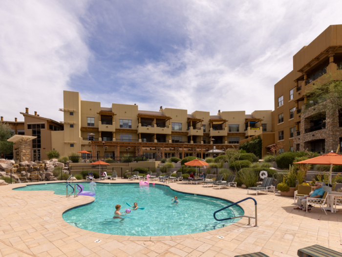 Residents enjoying a pool at the facility