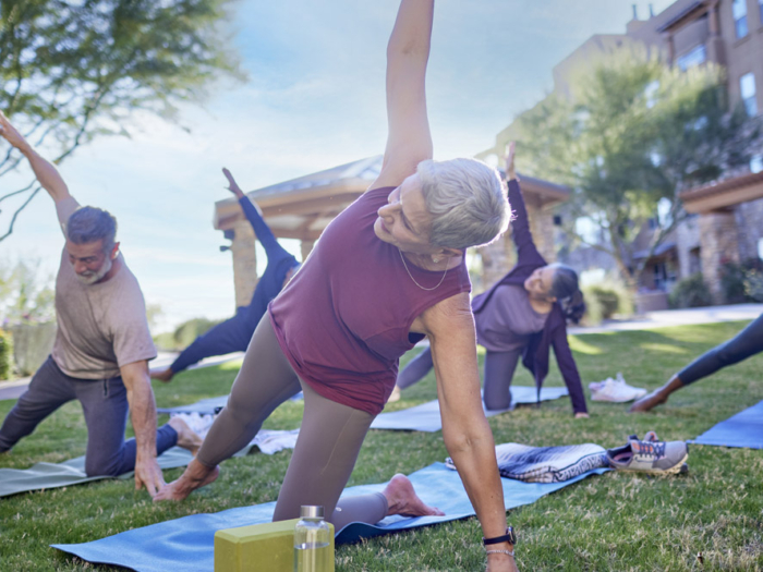 Residents participating in an outdoor yoga class