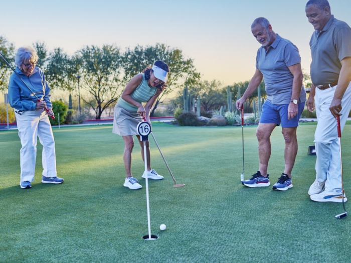 Residents enjoying a game of golf outside