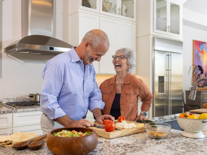 Couple cooking together in a modern kitchen