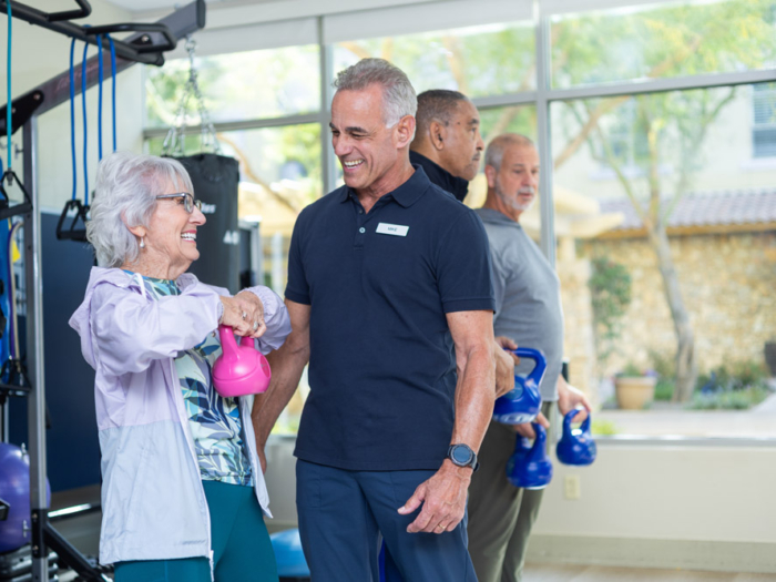 Residents participating in a fitness activity with staff