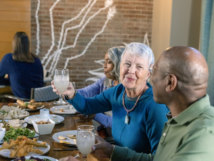 Residents enjoying a meal and drinks at the dining area