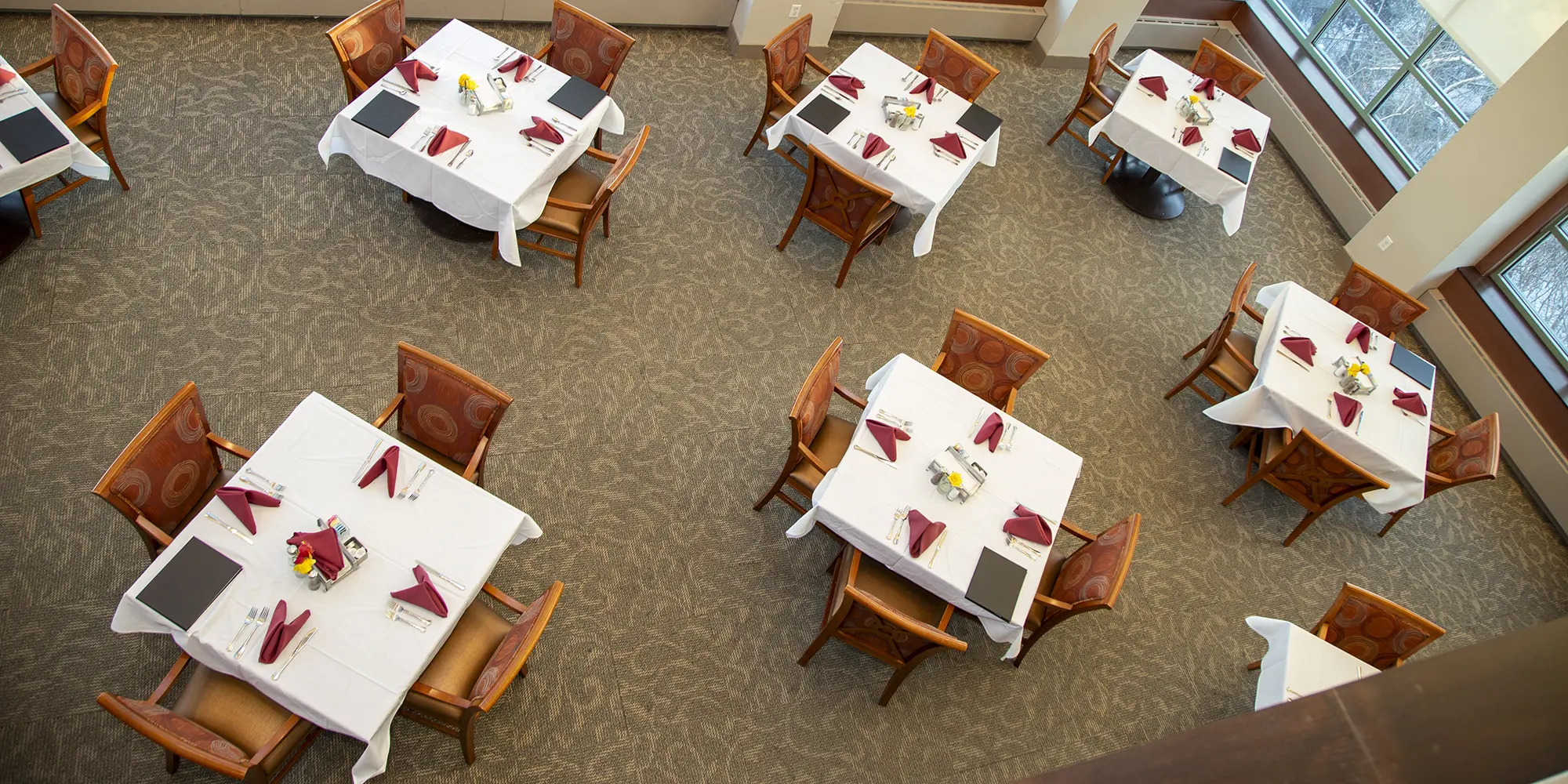 Dining area with elegantly set tables and decor