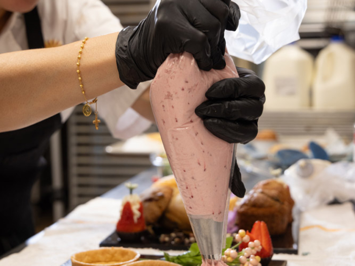 Chef preparing dessert in a kitchen