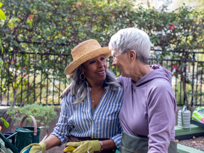Two residents gardening and enjoying time together