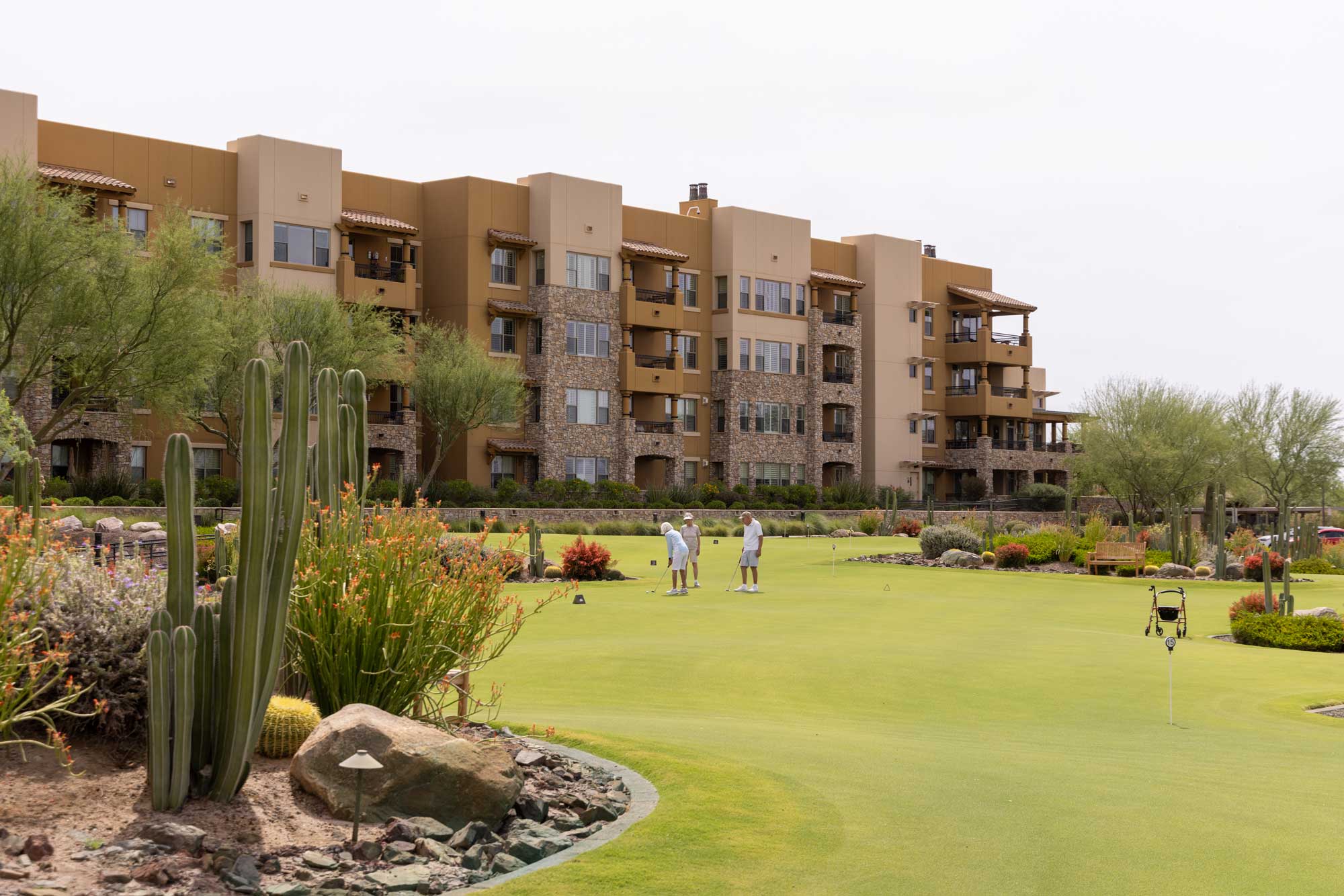 Residents enjoying the outdoor space with landscaped gardens
