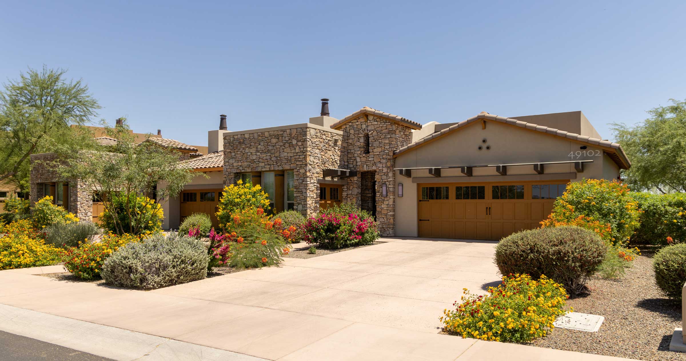 Exterior view of Acacia Health Center with vibrant landscaping
