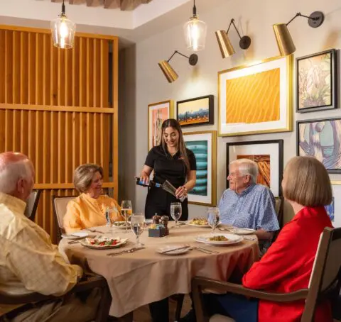 Residents enjoying a meal in a dining room