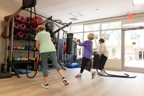 Residents participating in a fitness activity in the gym
