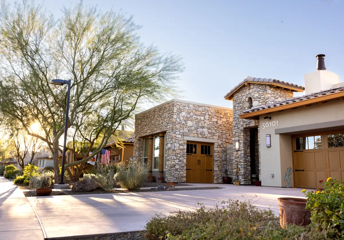 Exterior view of a senior living facility with landscaping