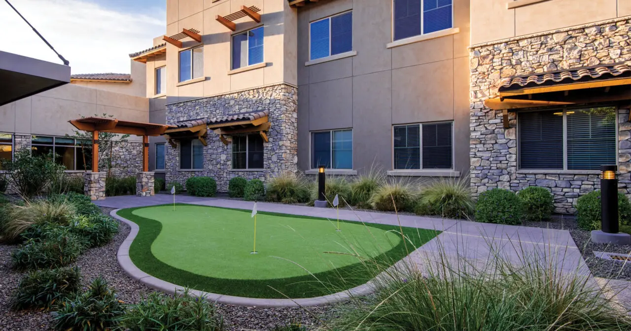 Exterior view of the facility with landscaped outdoor space