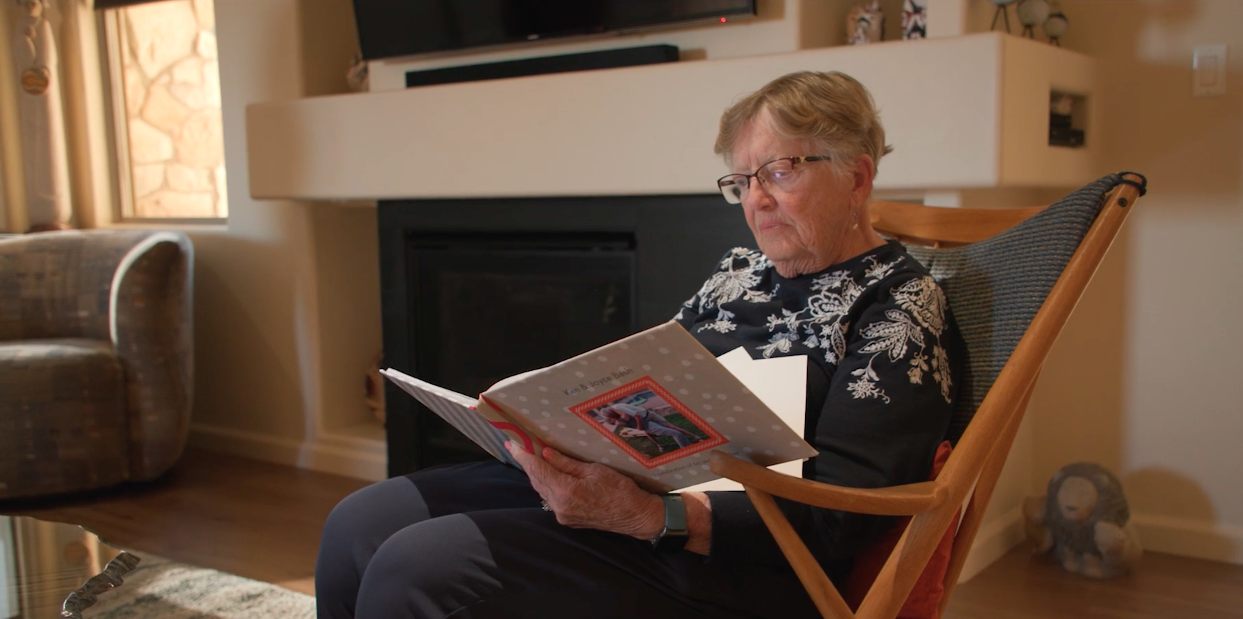 A resident reading in a cozy living area