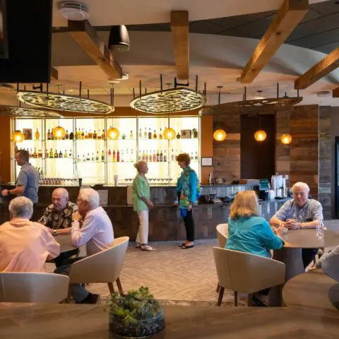 Residents socializing in a warm common area