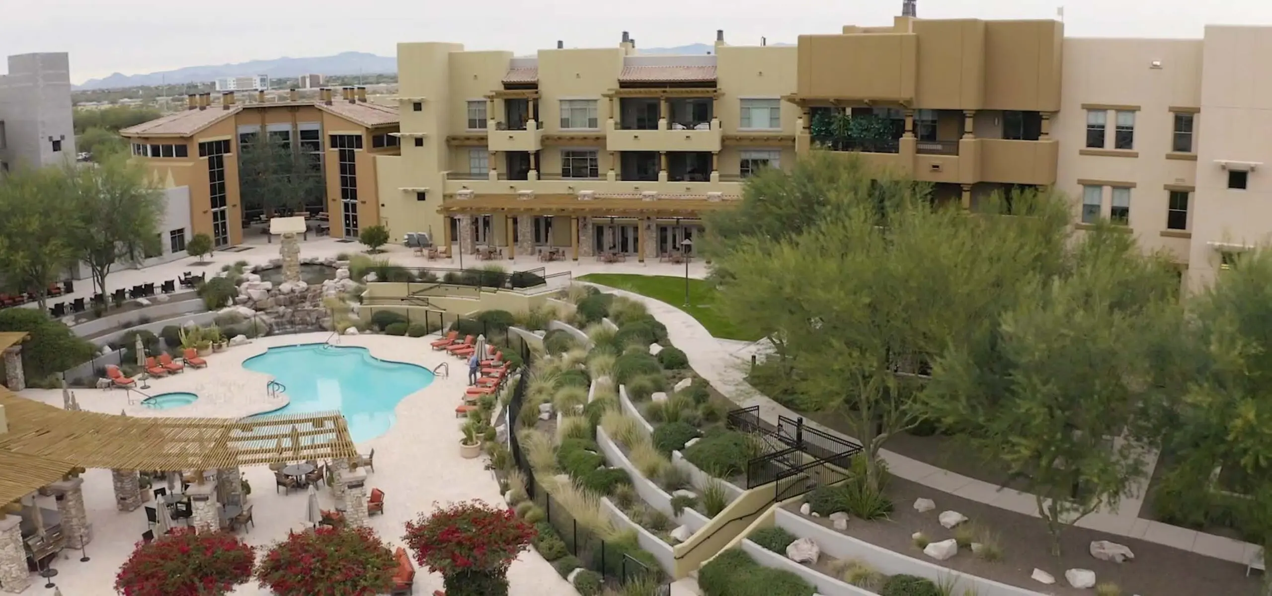 Aerial view of the Acacia Health Center with a pool