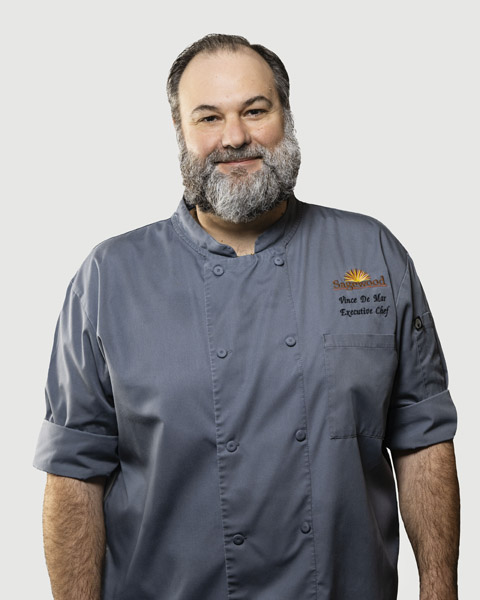 Portrait of an executive chef in a gray uniform