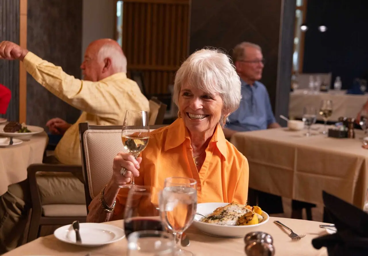 Residents enjoying a meal in the dining room