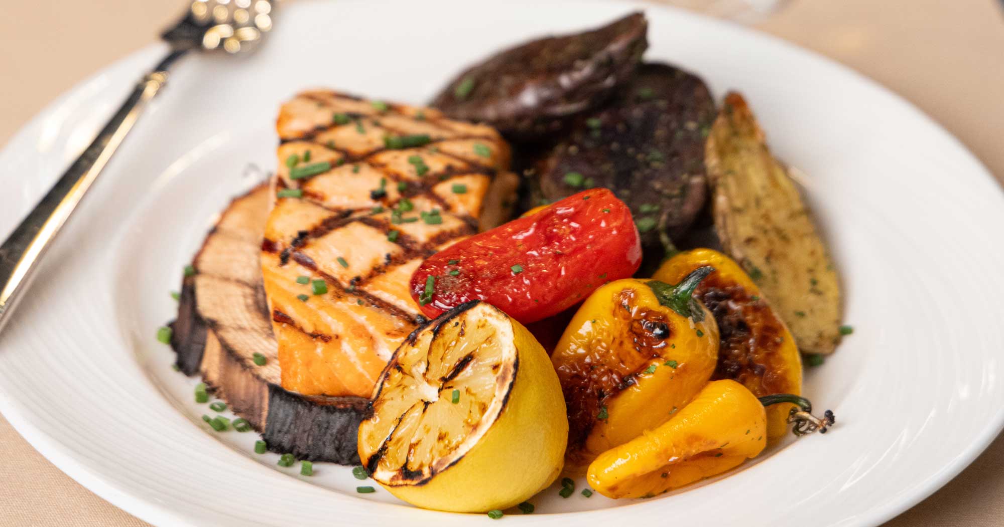 Grilled salmon with colorful grilled vegetables