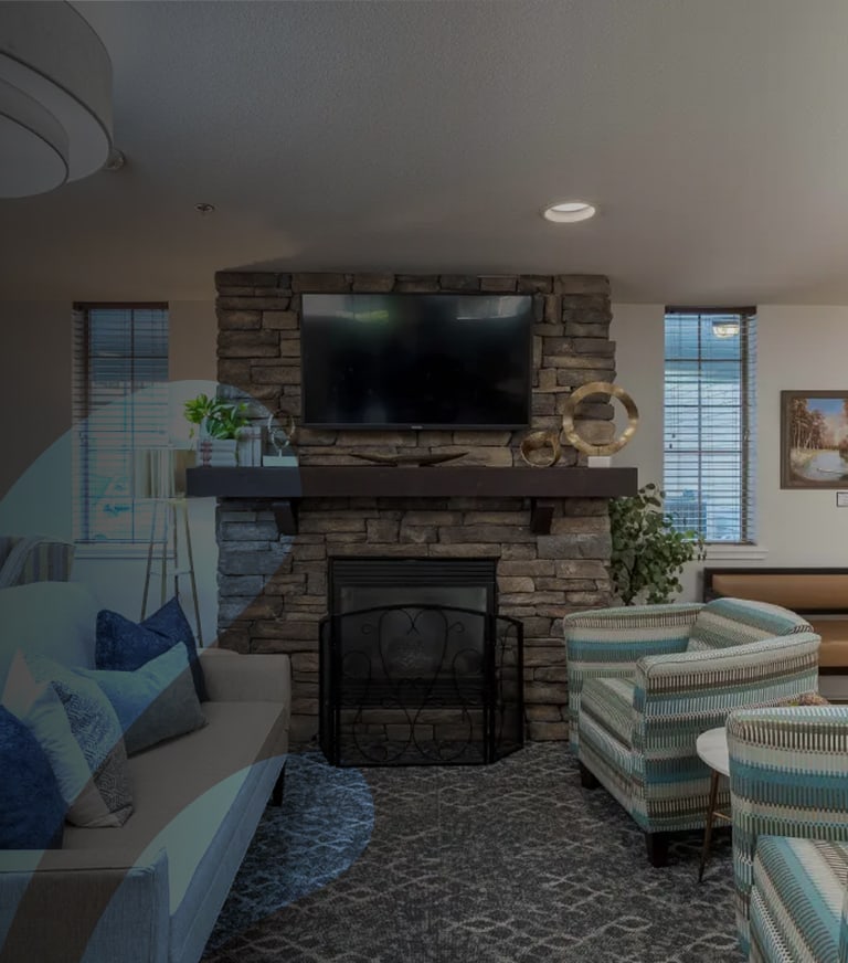 Cozy common area with fireplace and seating.