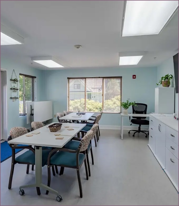Bright common area with tables and chairs