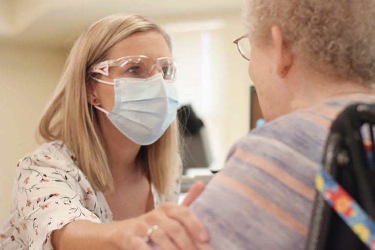 Caregiver interacting with a resident.