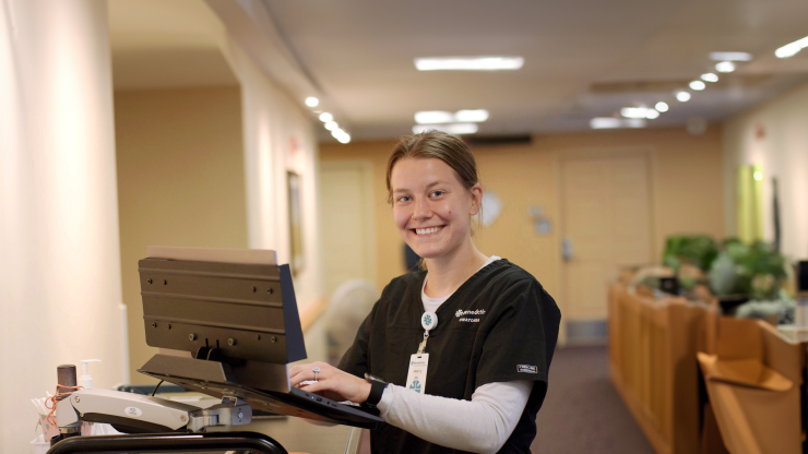 Staff member assisting with care in the facility