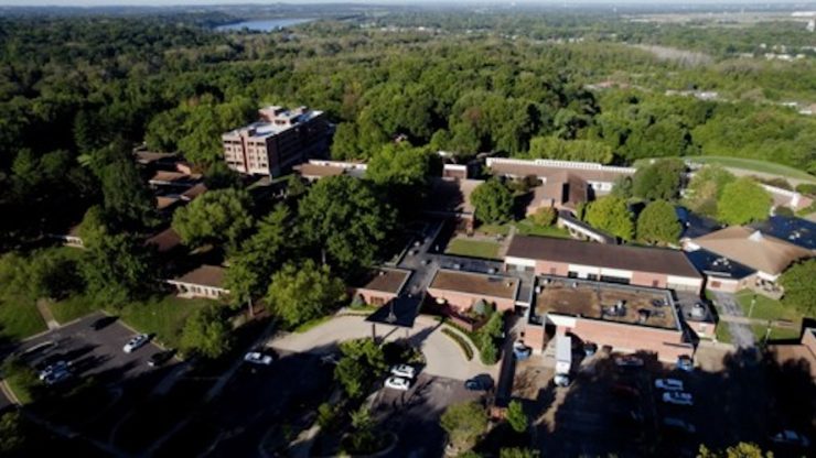 Aerial view of the assisted living facility surrounded by greenery.