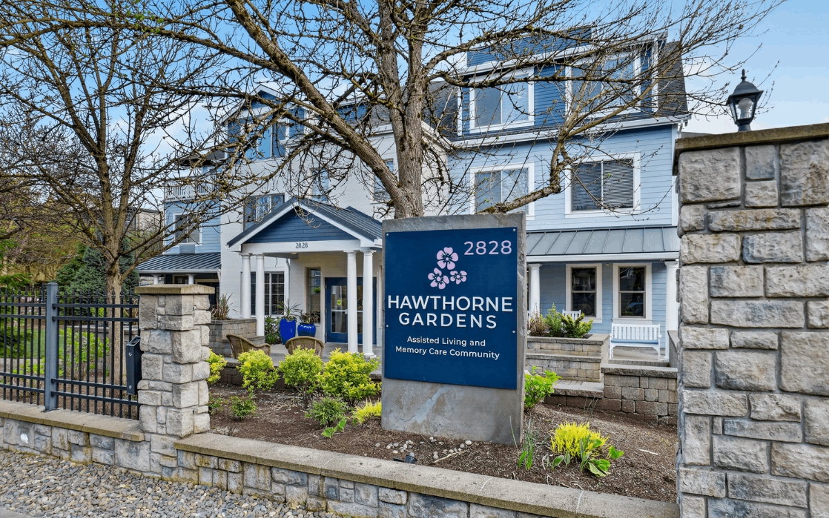 Exterior view of Hawthorne Gardens with signage