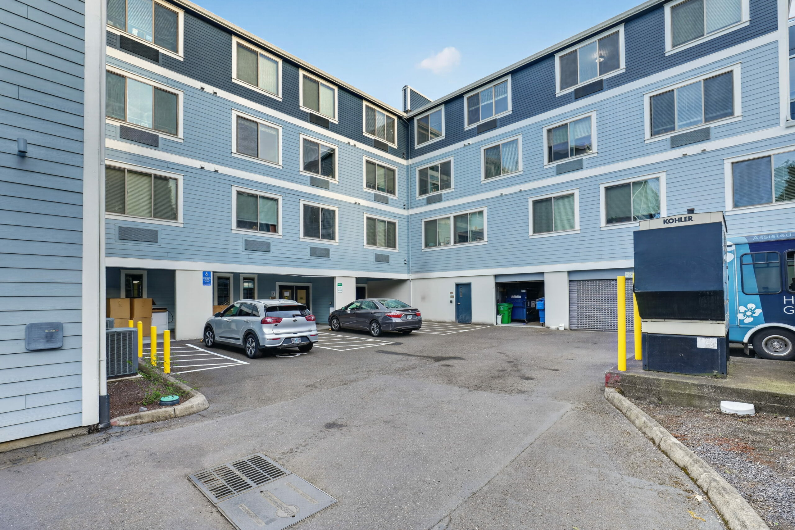 Exterior view of a nursing home building with parking.