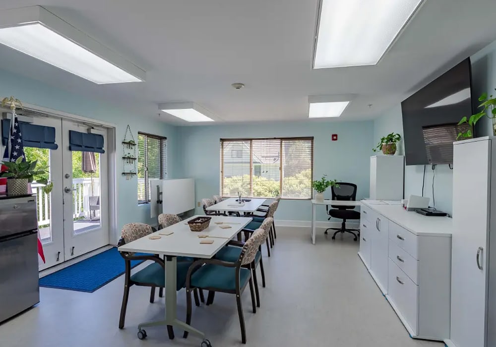 Bright common area with tables and chairs