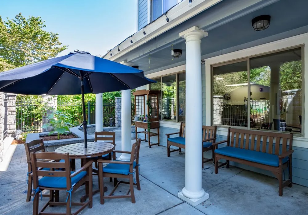 Outdoor seating area with tables and umbrellas