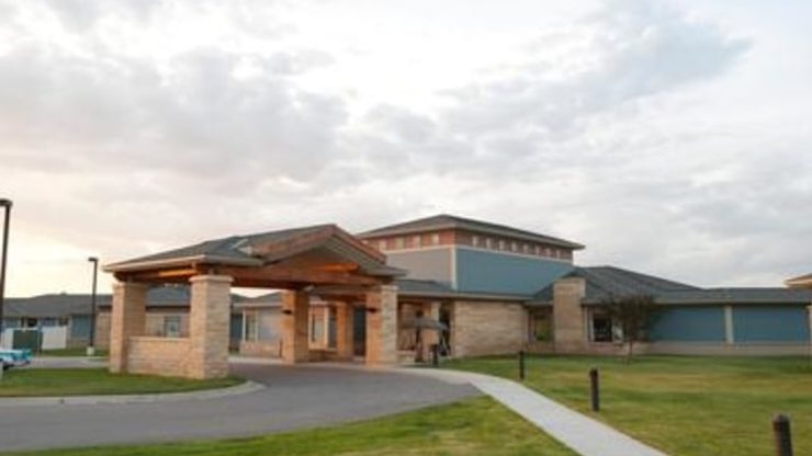 Exterior view of the facility building entrance.