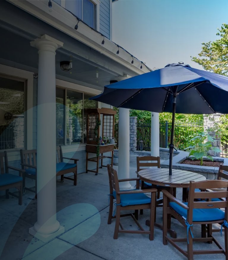 Outdoor seating area with umbrellas and tables.