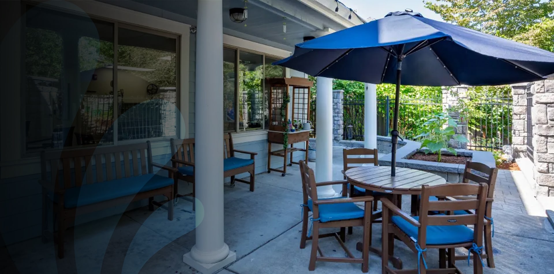 Outdoor seating area with tables and umbrellas