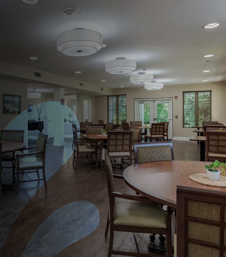 Bright common area with tables and chairs