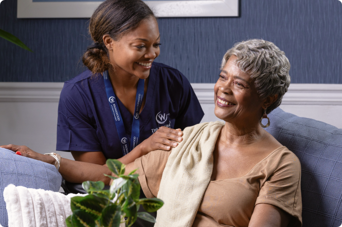 Caregiver interacting with senior resident